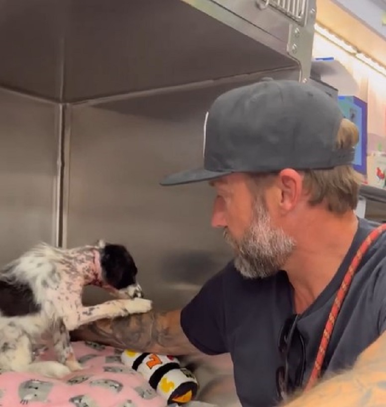 guy with cap and dog