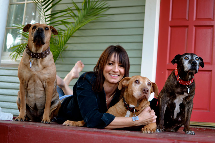 smiling woman with dogs