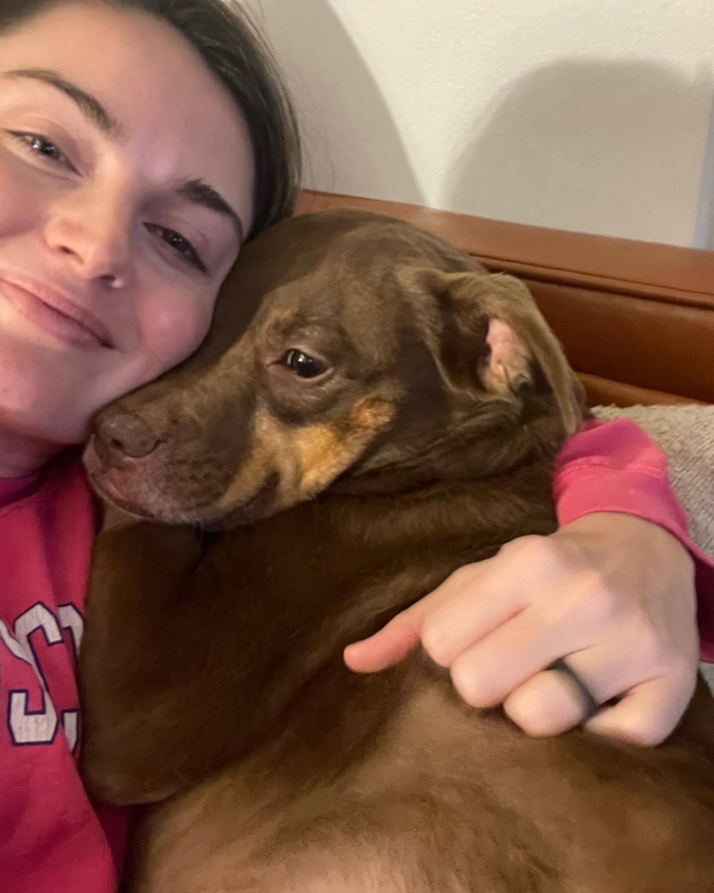 young woman hugging with dog